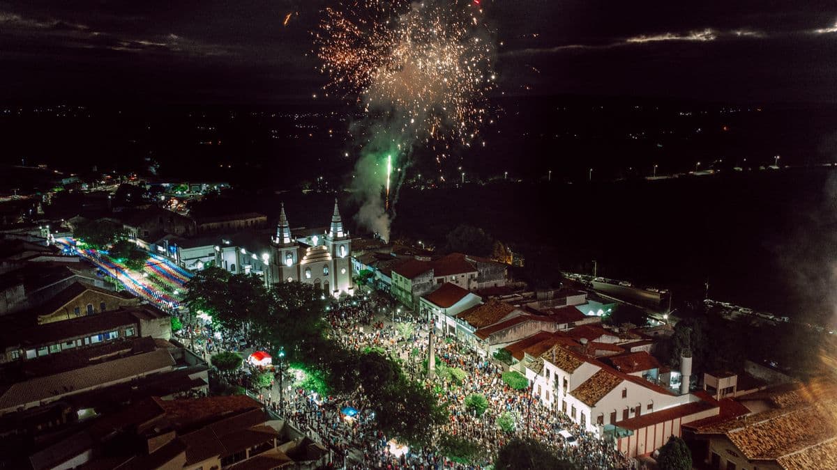 Aerial view of fireworks over a small town at night