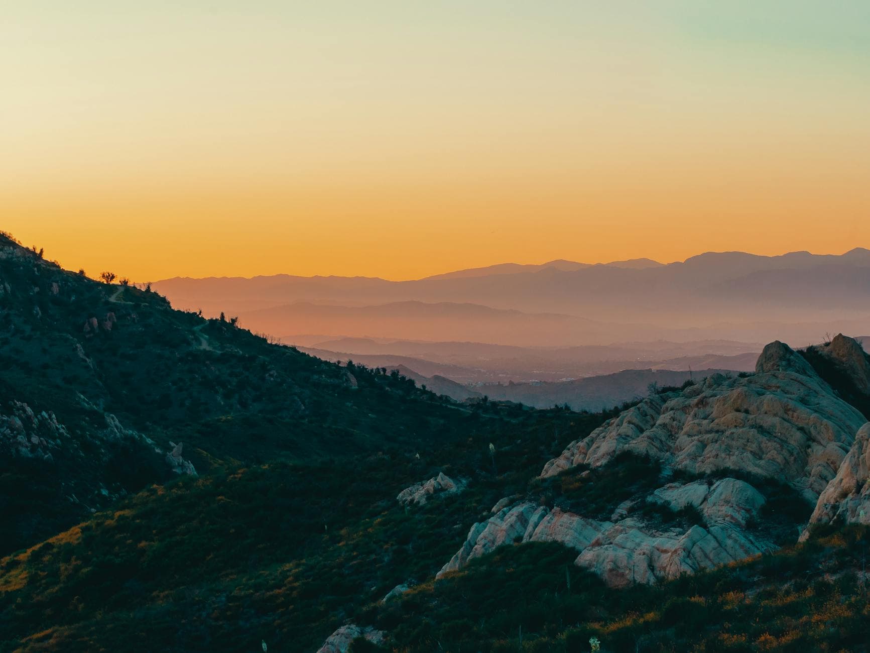 Layered mountain ridgelines above the Ojai Valley at golden hour