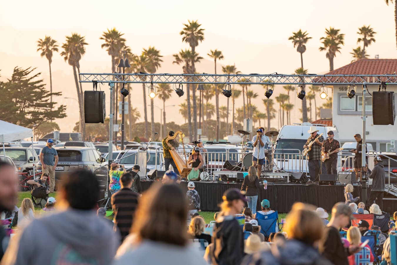 A crowd at a live outdoor music stage during a Fourth of July celebration in downtown Ventura