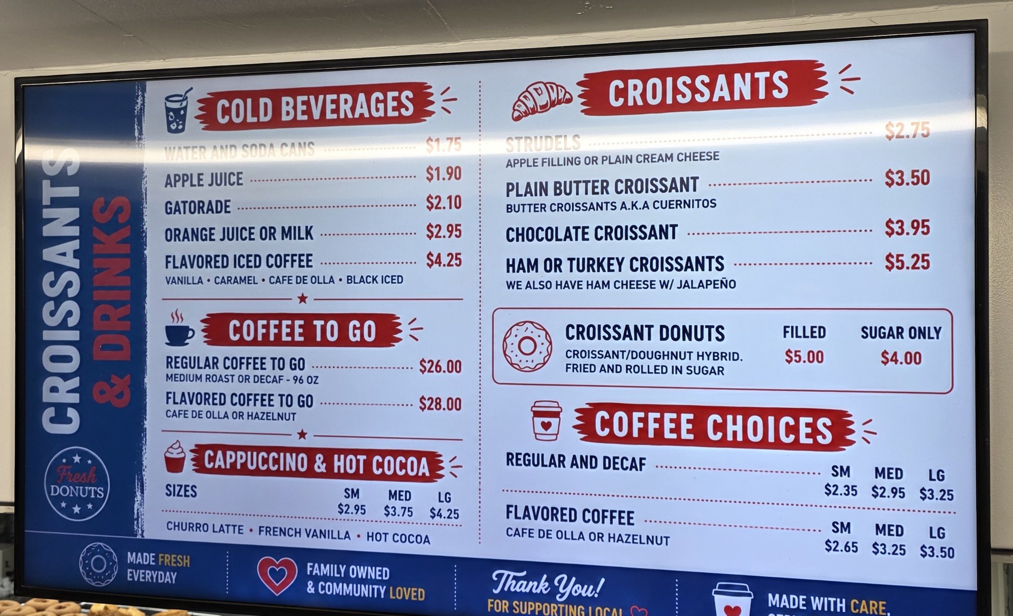 The Rolling Pin Donuts croissants and drinks menu board listing croissant donuts, croissants, strudels, coffee, cappuccino and cold drinks with prices